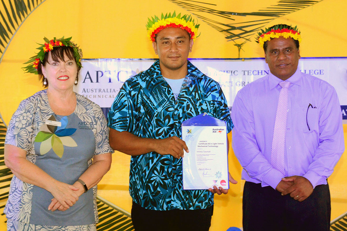 APTC CEO, Ms Denise O’Brien, Certificate III in Light Vehicle Mechanical Technology graduate, Mr Miteta Taomati and Kiribati Minister for Labour and Human Resources Development, Honourable Mr Ruateki Tekaiara