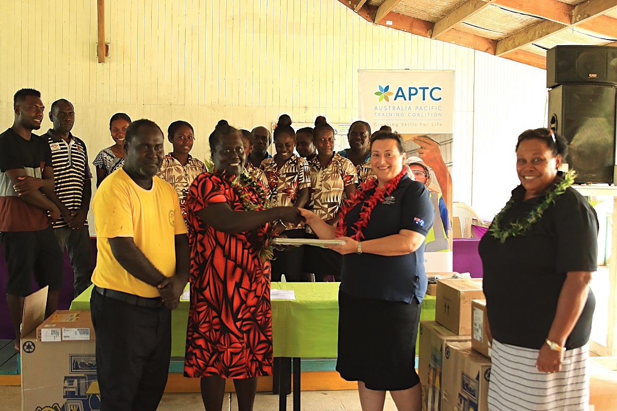 Second Secretary at the Australian High Commission in Solomon Islands, Christina Skoumbourdis, hands over laptops to Tabaka RTC staff and students